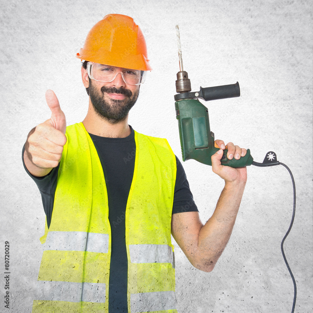 workman with drill over white background workman with drill over white background