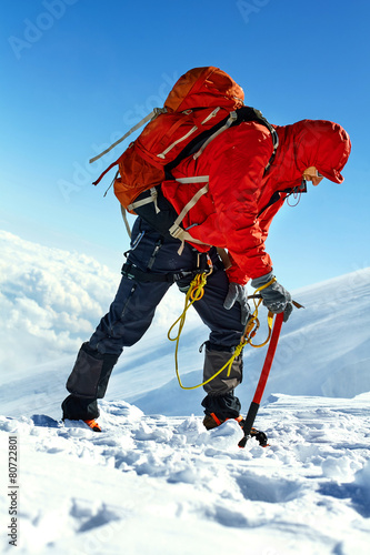 hiker at the top of a pass