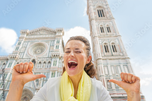 Happy woman pointing on herself in front of duomo in florence © Alliance