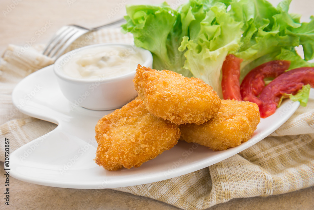 Fish nuggets and dip sauce on plate