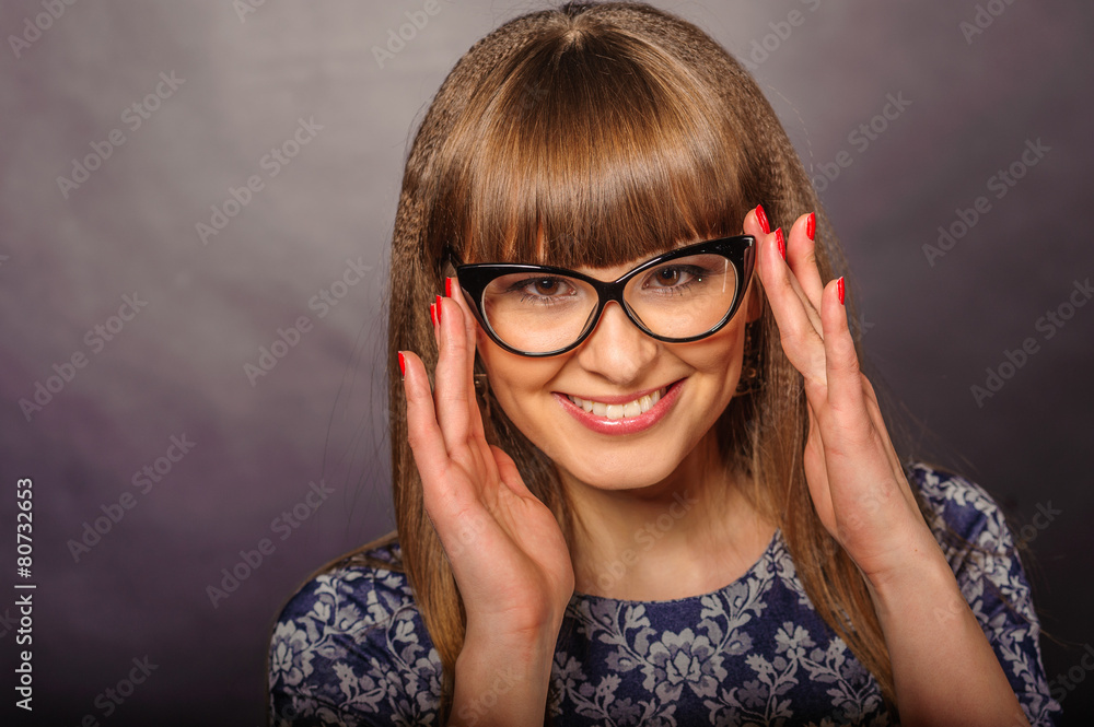 Young girl posing in studio playing with spectacles Young girl posing in studio playing with spectacles