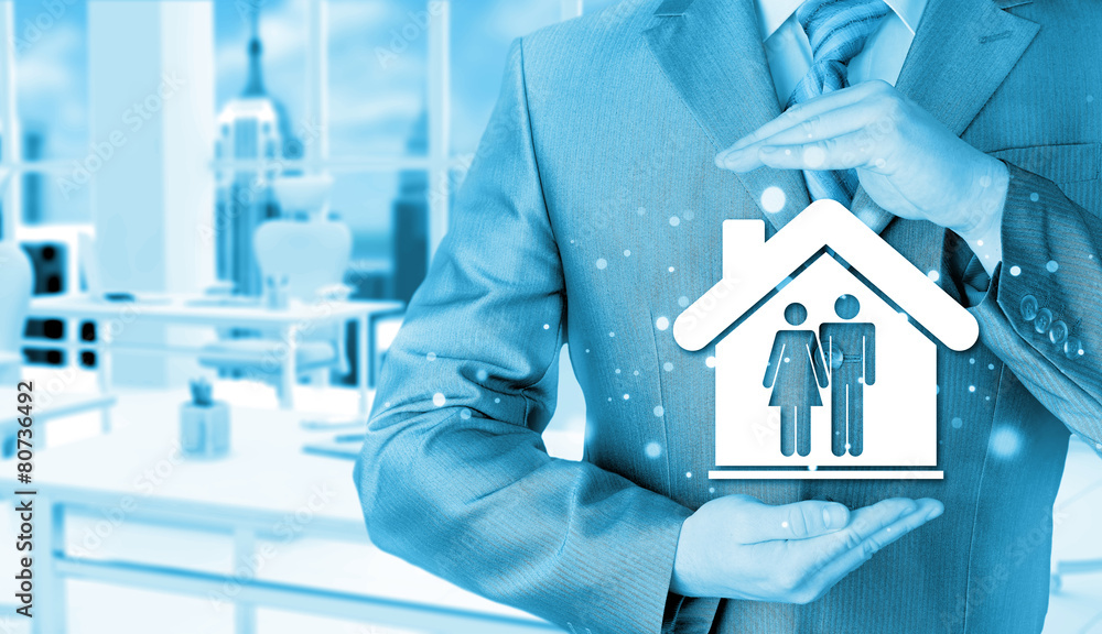 businessman protecting family in home with hands businessman protecting family in home with hands