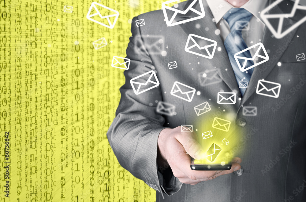 Business man holding smart phone and sending emails Business man holding smart phone and sending emails