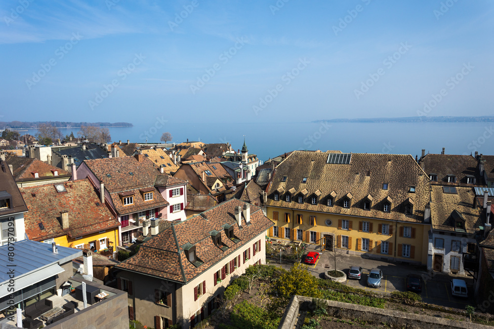Aerial view of swiss houses with lake on background