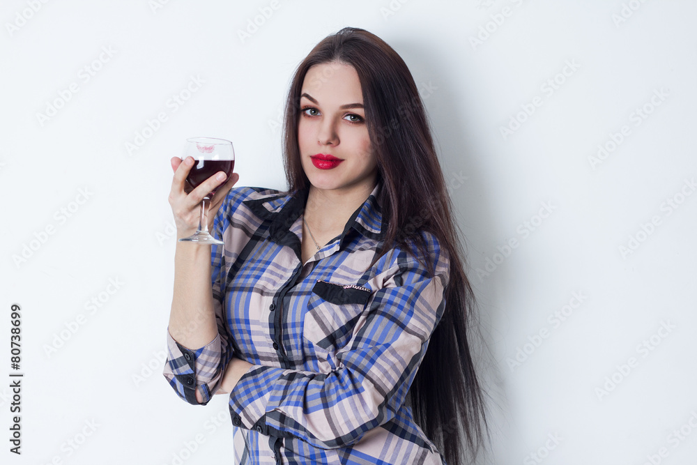 Attractive smiling girl with a glass of red wine Attractive smiling girl with a glass of red wine