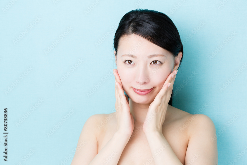 attractive asian woman on blue background attractive asian woman on blue background