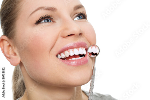 Dentist visit. Teeth inspection. Close-up of smiling female.
