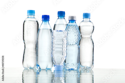 Different water bottles isolated on white