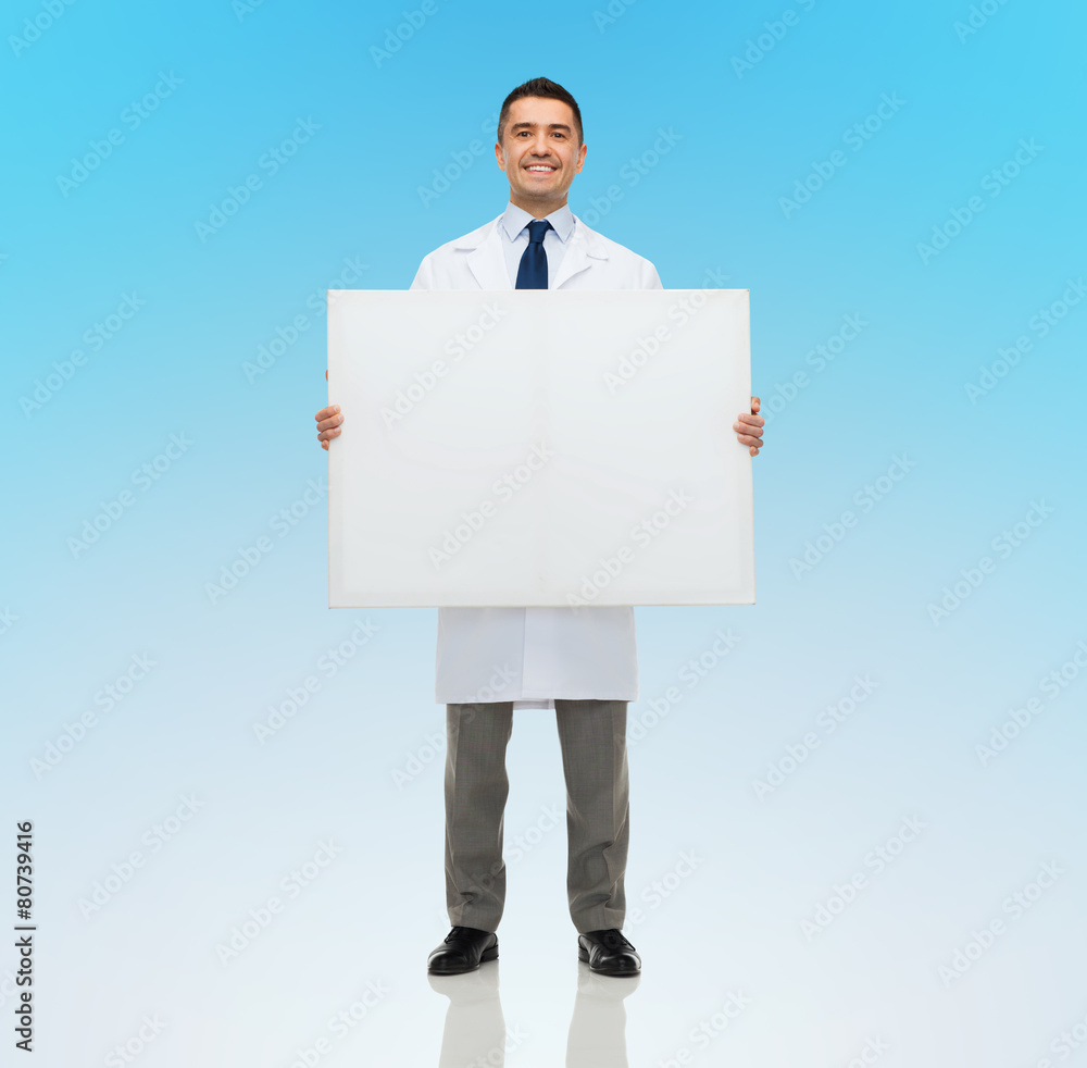 smiling male doctor holding white blank board smiling male doctor holding white blank board