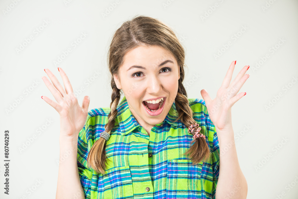 positive surprised teen girl with pigtails Stock Photo | Adobe Stock