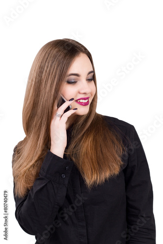 Girl talking on a mobile phone. Portrait of a girl with a