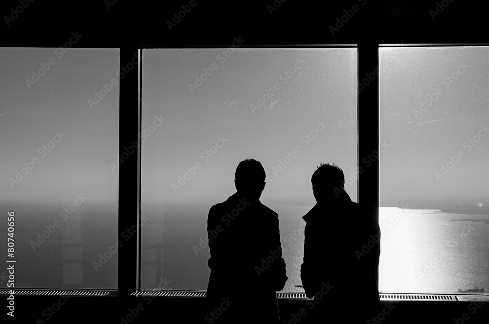 Silhouette couple in a window
