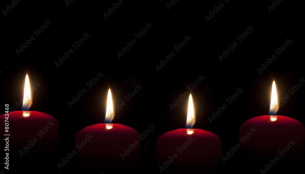 red candles lighting in the darkness red candles lighting in the darkness
