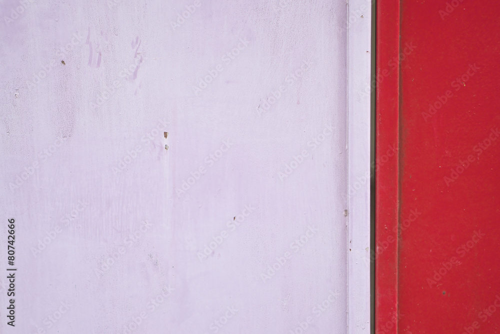 Old and rust pink and red metal door Old and rust pink and red metal door