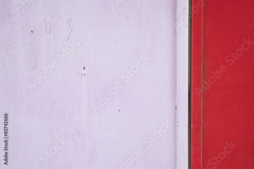 Old and rust pink and red metal door