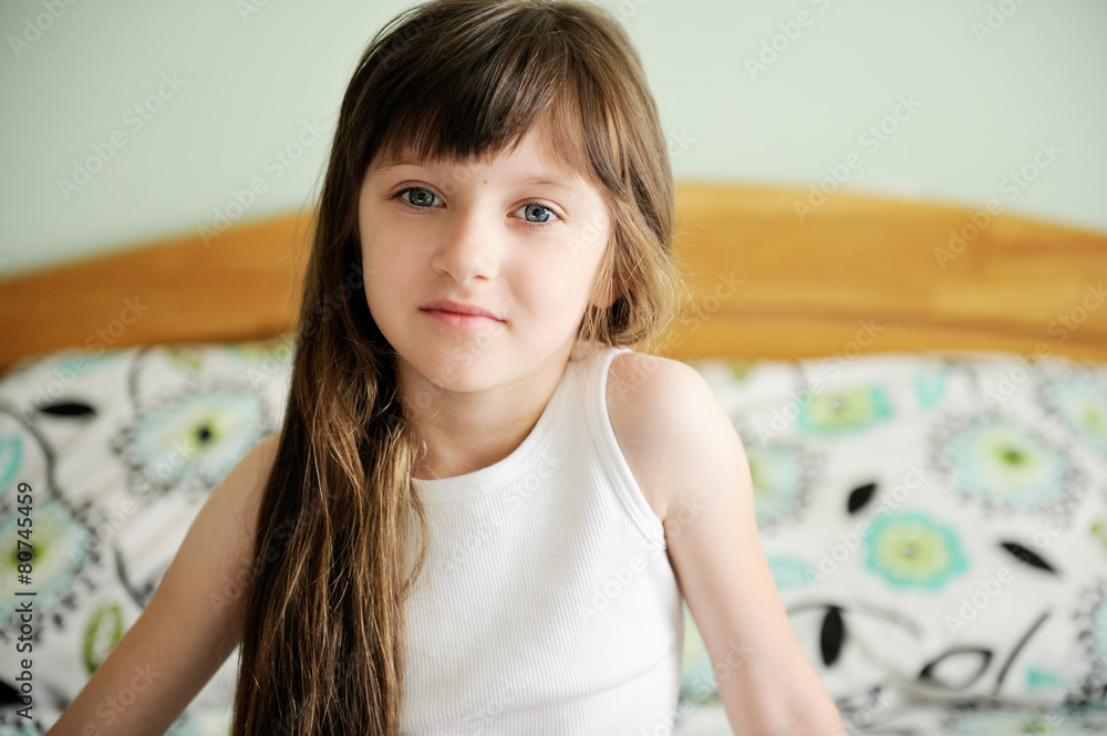 Adorable little girl awaked up in her bed Adorable little girl awaked up in her bed