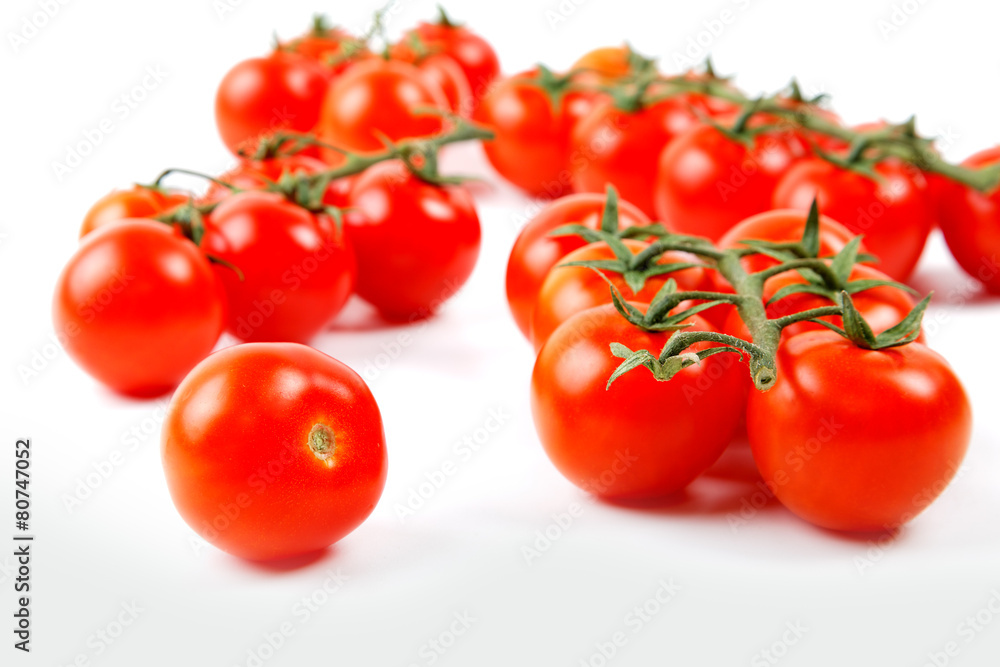 bunnch of cherry tomatoes isolated on a white background bunnch of cherry tomatoes isolated on a white background