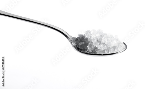 Spoon full of white salt