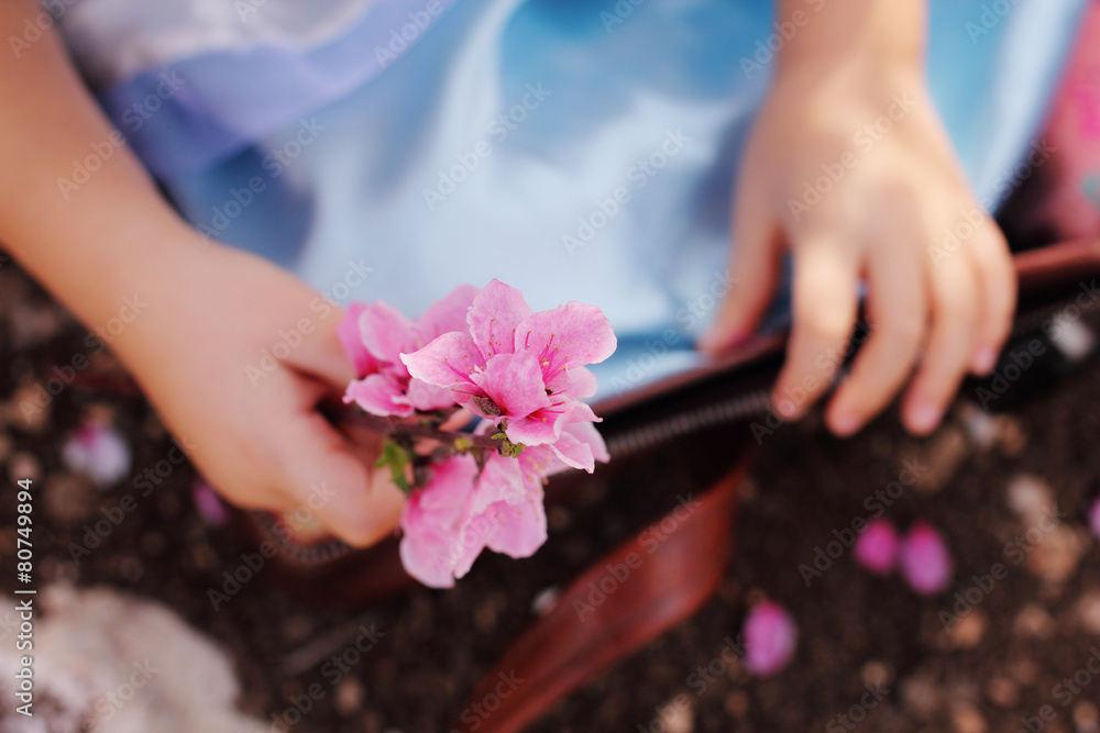 Little Girl Holding Flower