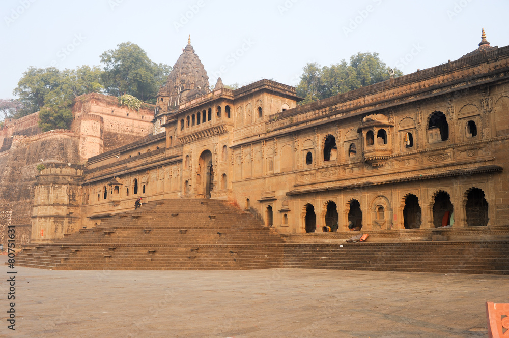 People walking in front of Maheshwar palace on India