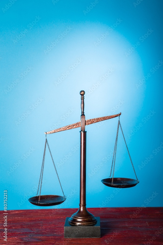 Law. Justice scale with blue highlight in the background Law. Justice scale with blue highlight in the background