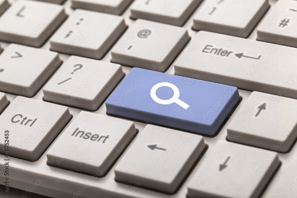 Keyboard. Search key on a white keyboard Keyboard. Search key on a white keyboard