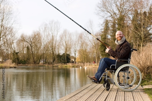 young man in a wheelchair fishing