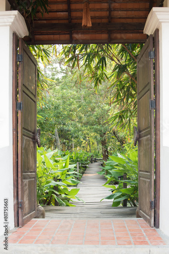 entrance gate to tropical garden #80755663