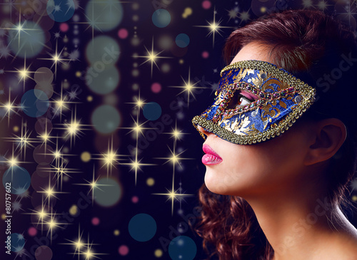Beautiful girl with masquer...