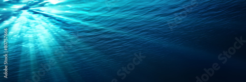 Photo underwater - blue shining in deep of the sea