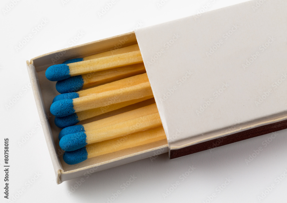 White box of matches with blue tips White box of matches with blue tips