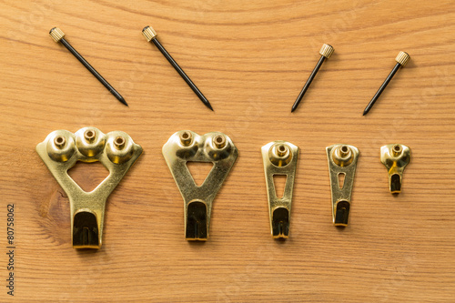 Set of picture hanging hooks and nails photo