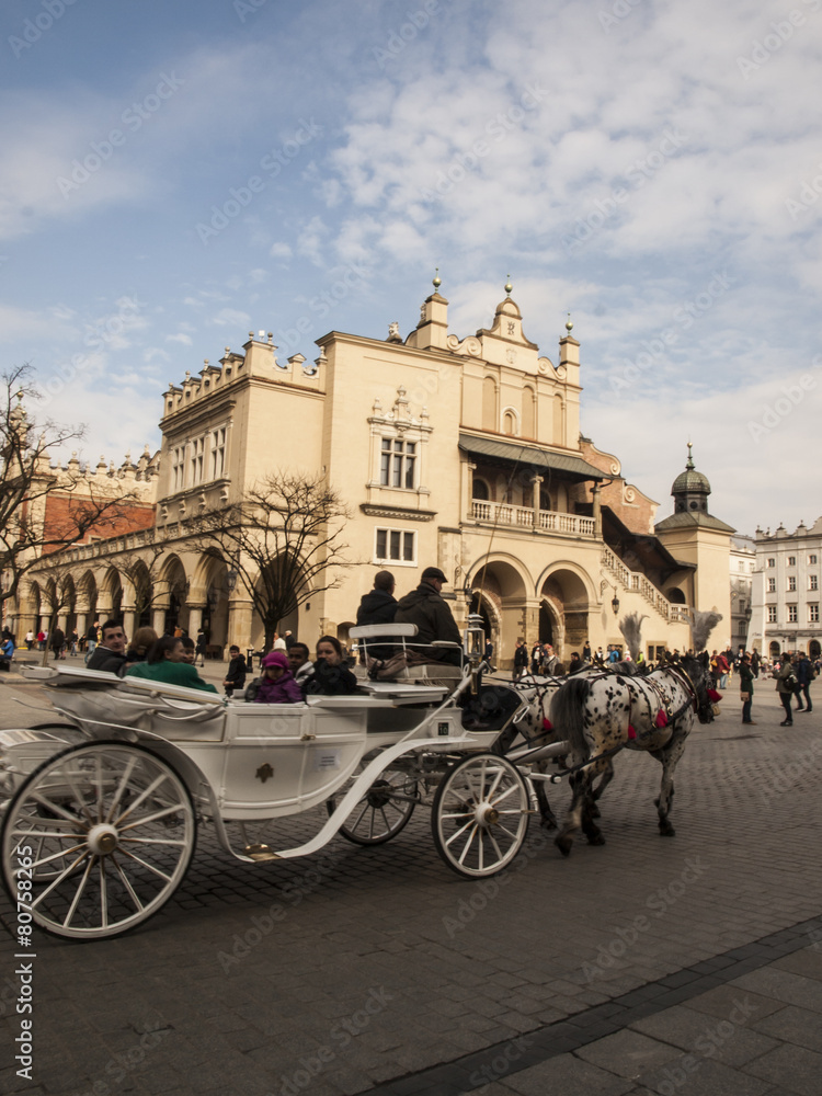 Fototapeta premium KRAKOW, POLAND - March 29, 2015: Horse carriage on the streets o