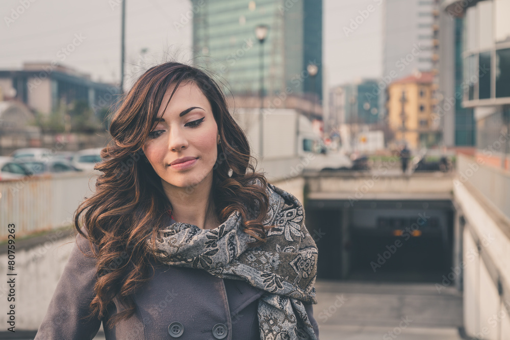 Fototapeta premium Beautiful girl posing in an urban context