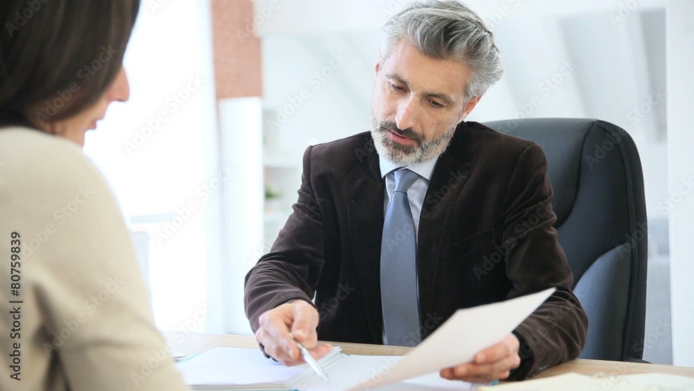 Attorney and client meeting in office for signature Attorney and client meeting in office for signature