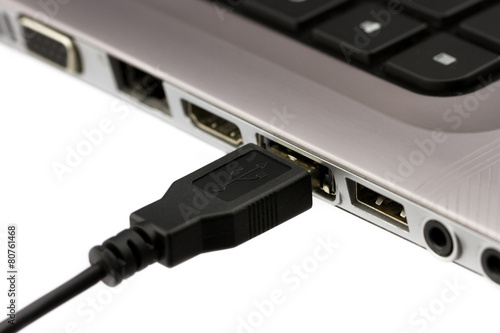 USB cable plugged in to laptop computer  