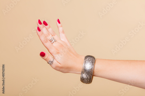 Картината върху платно Female hand with manicure and armlet