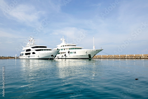Two white luxury boats at the marina © cn0ra