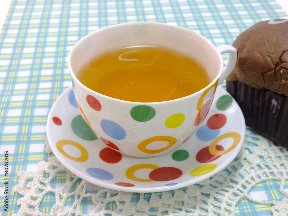tea and chocolate bread on blue table cloth tea and chocolate bread on blue table cloth