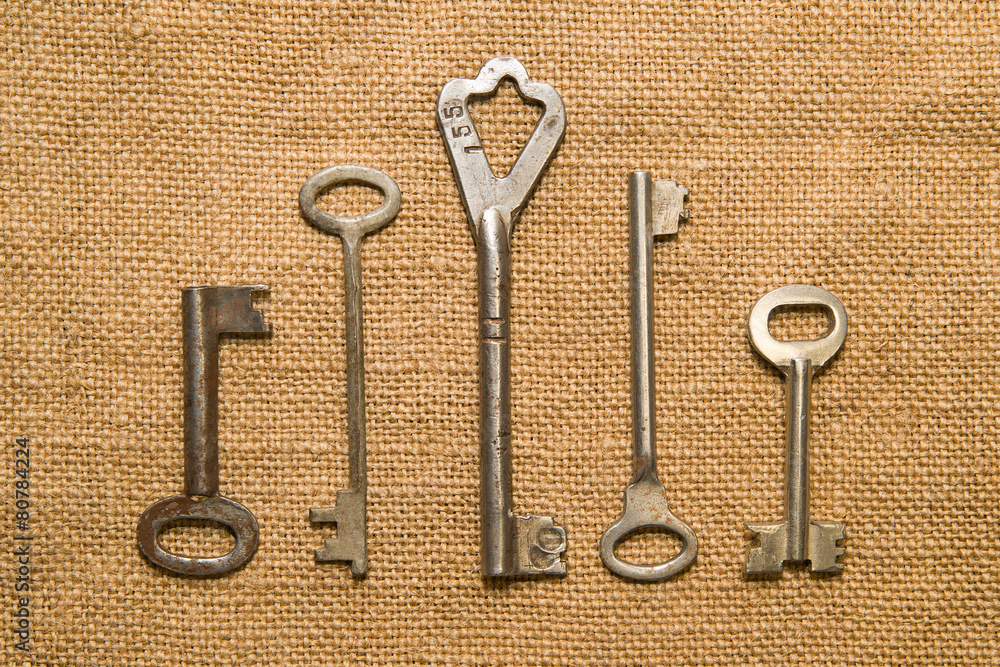 Four old keys to the safe on a very old cloth Four old keys to the safe on a very old cloth