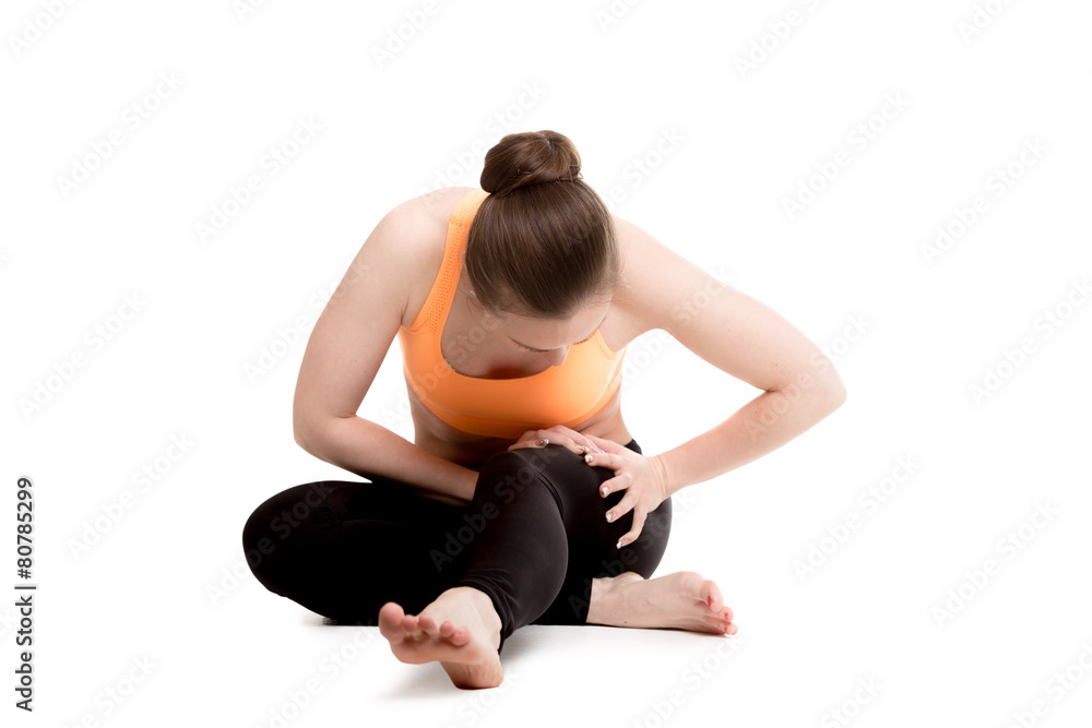 Young female athlete touching injured thigh Young female athlete touching injured thigh