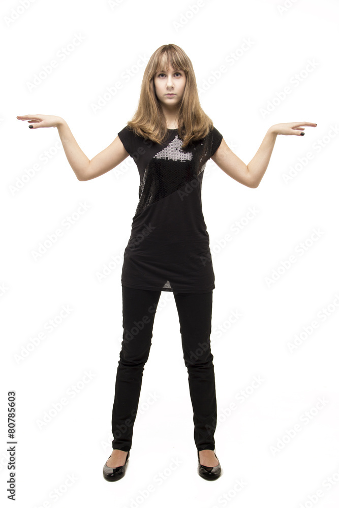 Young cheerful girl standing in the studio isolated Young cheerful girl standing in the studio isolated
