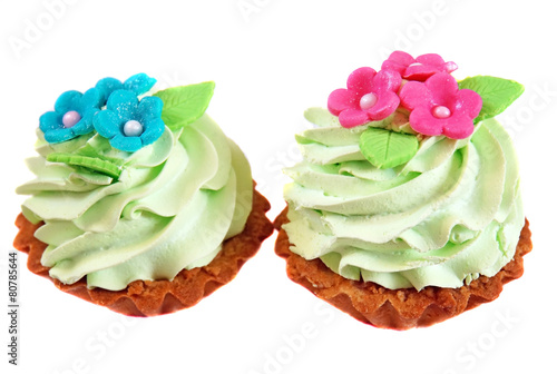 Cake basket decorated with light green cream and pink flowers fr