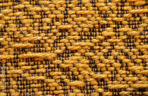 Woolen upholstery with orange color with a pattern of black thre