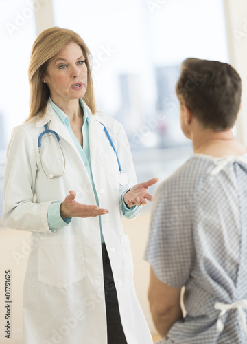 Female Doctor Discussing With Patient In Hospital