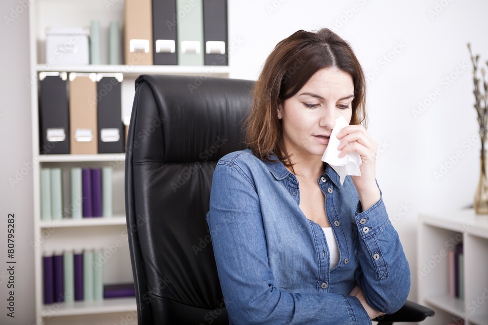 Distressed businesswoman sitting crying Distressed businesswoman sitting crying