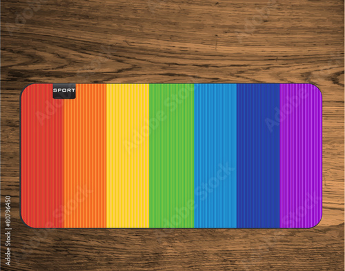 rainbow yoga mat on wood texture floor
