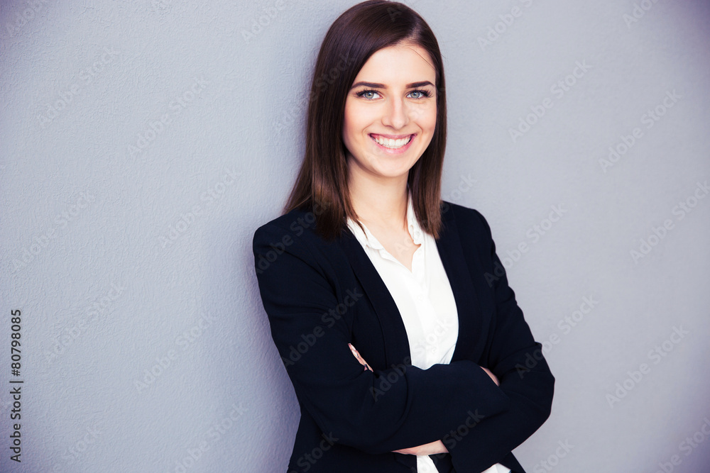 Happy young businesswoman with arms folded Happy young businesswoman with arms folded