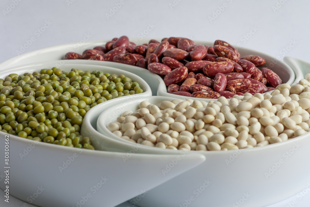 Multicolored beans in ceramics bowl Multicolored beans in ceramics bowl