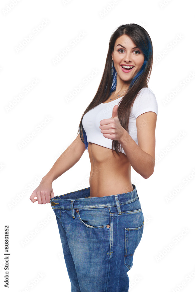 Young woman delighted with her dieting results Young woman delighted with her dieting results